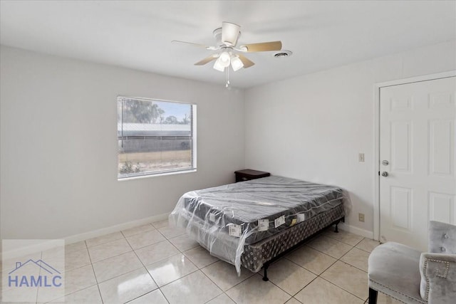 bedroom featuring ceiling fan, light tile patterned flooring, and pool table