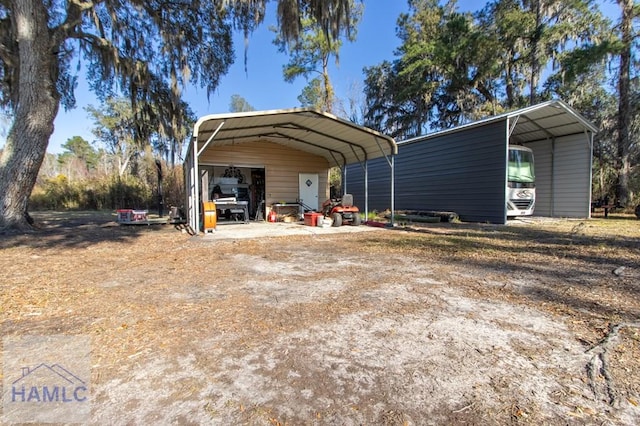 view of outdoor structure with driveway