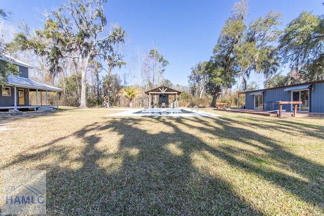 view of yard featuring a wooden deck and a gazebo