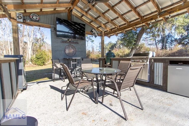 view of patio / terrace with outdoor dining area, grilling area, and an outdoor kitchen