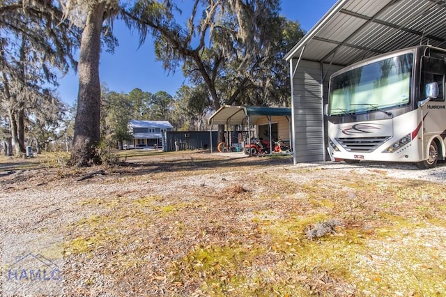 view of yard with a detached carport