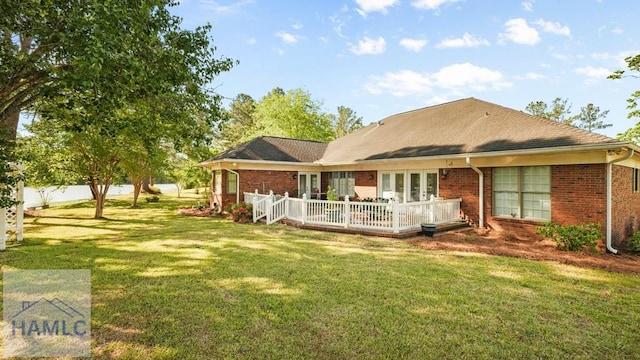 7 S Lake Dr, Jesup, GA 31546 - back of property with brick siding, a yard, french doors, and a deck