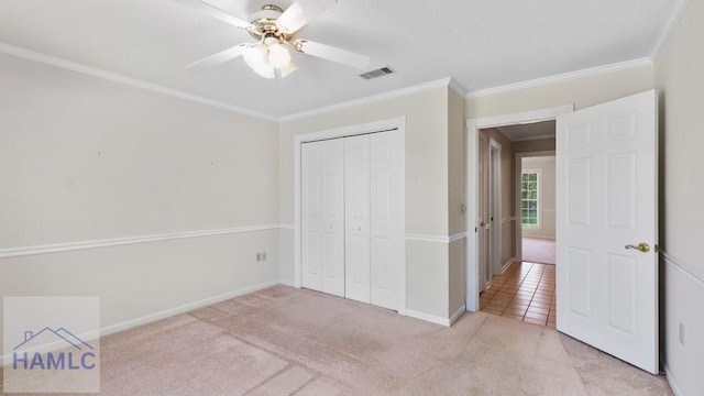 7 S Lake Dr, Jesup, GA 31546 - unfurnished bedroom with light carpet, baseboards, visible vents, a closet, and crown molding