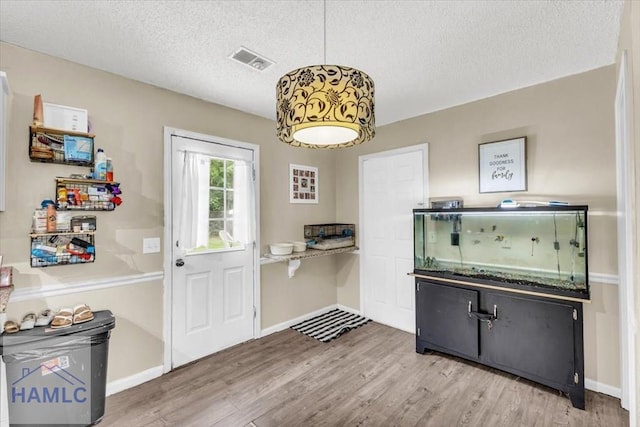 1325 Loblolly Dr, Hinesville, GA 31313 - dining area with wood finished floors and a textured ceiling