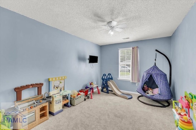 1325 Loblolly Dr, Hinesville, GA 31313 - recreation room with carpet flooring, a ceiling fan, and a textured ceiling