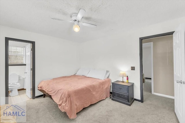 1325 Loblolly Dr, Hinesville, GA 31313 - bedroom featuring a textured ceiling, ensuite bath, carpet flooring, and ceiling fan