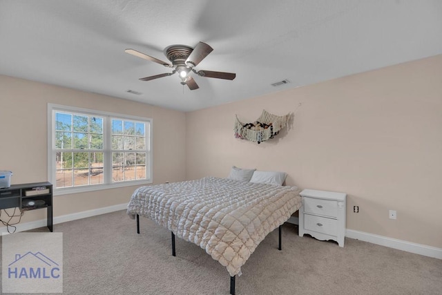 carpeted bedroom featuring ceiling fan