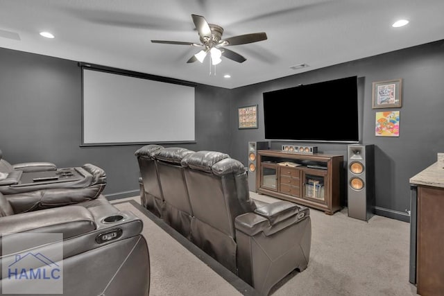 carpeted home theater featuring ceiling fan