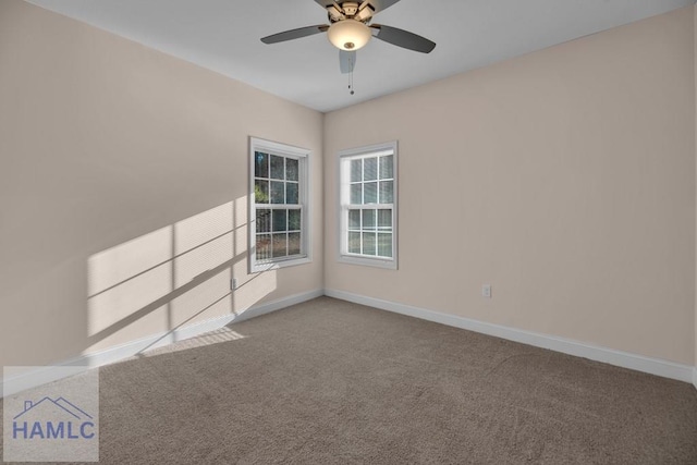 carpeted empty room with ceiling fan