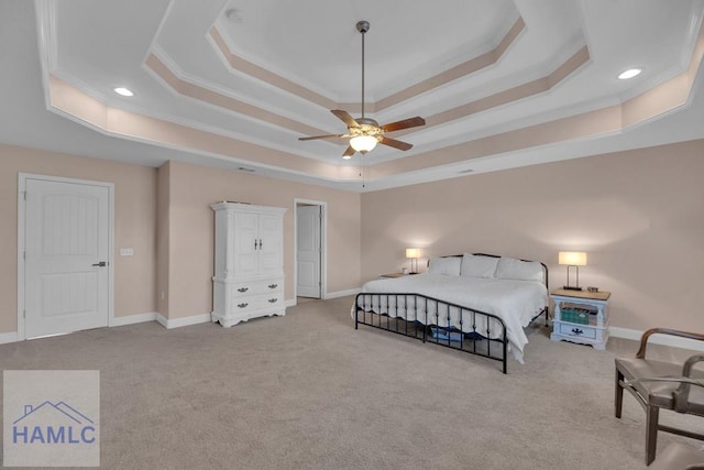 carpeted bedroom with crown molding, a raised ceiling, and ceiling fan