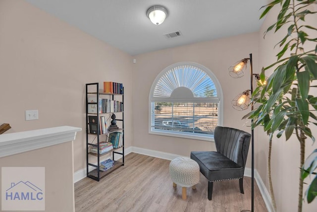 sitting room with light hardwood / wood-style flooring