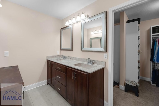 bathroom with vanity and tile patterned flooring