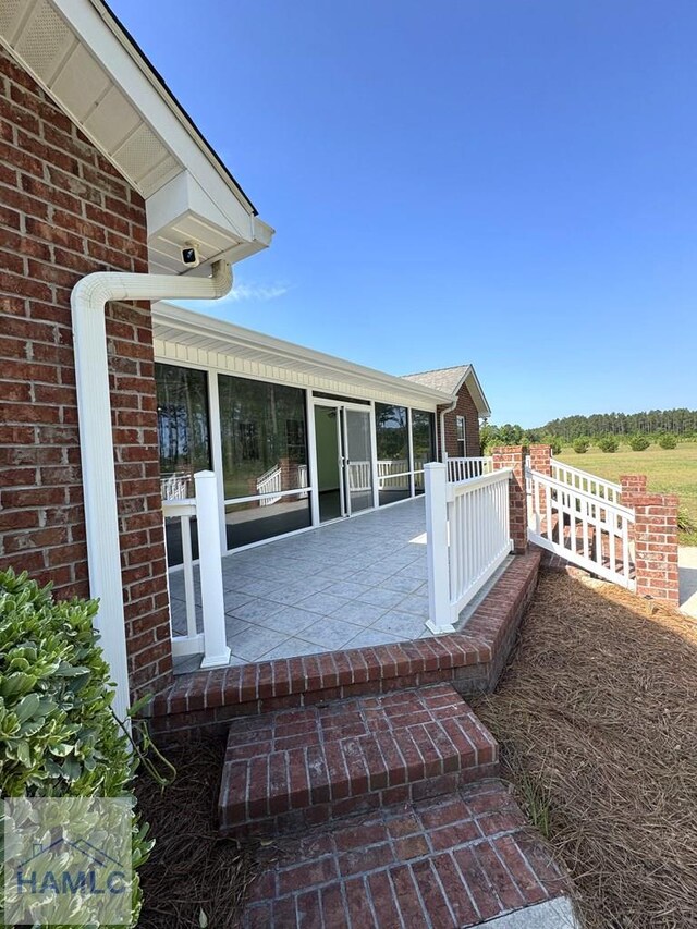 21 Forest Rd, Odum, GA 31555 - deck with a sunroom
