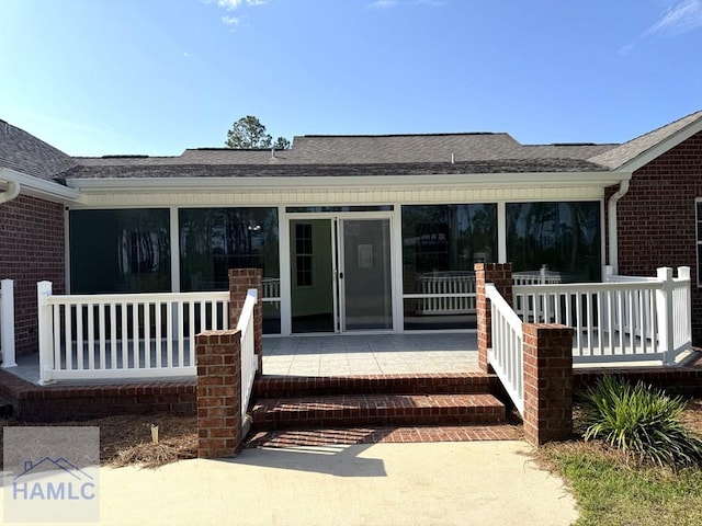 21 Forest Rd, Odum, GA 31555 - back of property featuring brick siding and roof with shingles