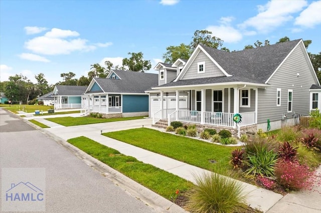 view of front of house featuring a front lawn and a garage