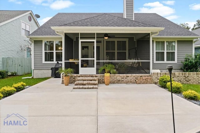 back of house featuring ceiling fan, a patio area, and a sunroom