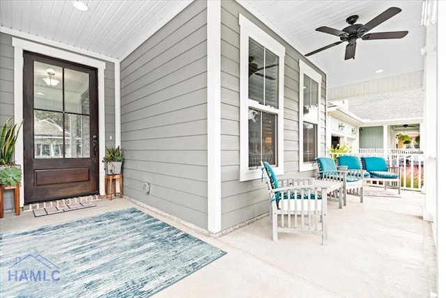 view of patio with ceiling fan and a porch