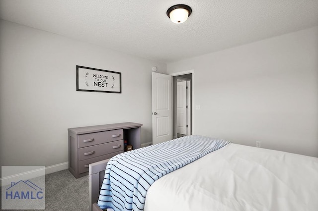 1201 Grayson Ave, Hinesville, GA 31313 - carpeted bedroom featuring baseboards and a textured ceiling