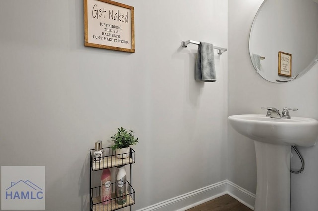1201 Grayson Ave, Hinesville, GA 31313 - bathroom with baseboards and wood finished floors