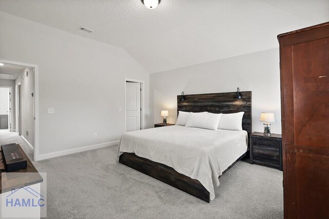 1201 Grayson Ave, Hinesville, GA 31313 - carpeted bedroom with vaulted ceiling and baseboards