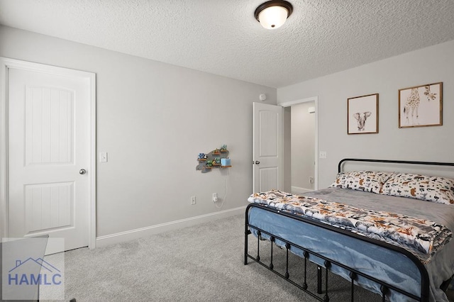 1201 Grayson Ave, Hinesville, GA 31313 - bedroom with carpet, a textured ceiling, and baseboards