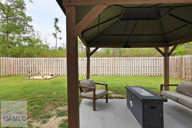 1201 Grayson Ave, Hinesville, GA 31313 - view of patio with a gazebo and an outdoor fire pit