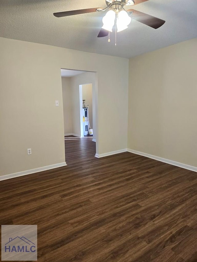 unfurnished room featuring a textured ceiling, ceiling fan, and dark hardwood / wood-style floors