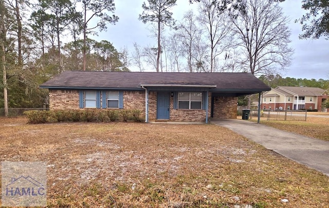 ranch-style home featuring a carport