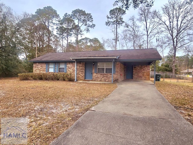 ranch-style house featuring a carport