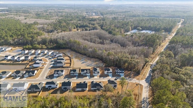 aerial view with a residential view and a view of trees