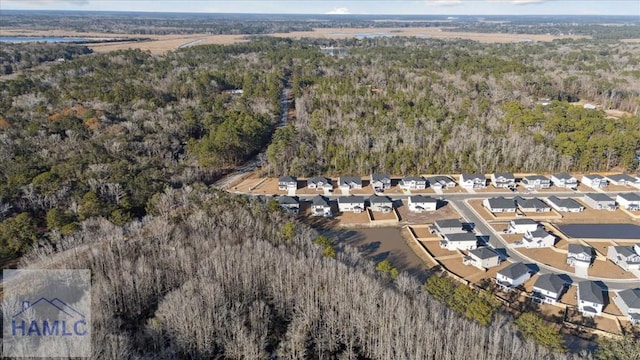 bird's eye view featuring a residential view and a forest view