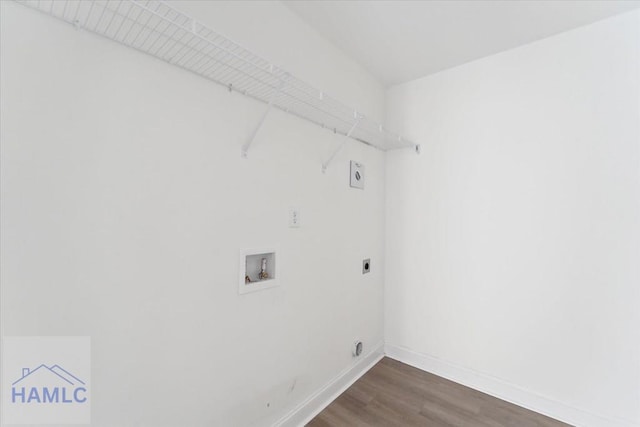 washroom with washer hookup, dark wood finished floors, electric dryer hookup, laundry area, and baseboards