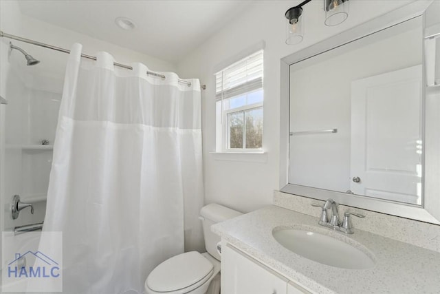 bathroom with toilet, shower / bath combo with shower curtain, and vanity