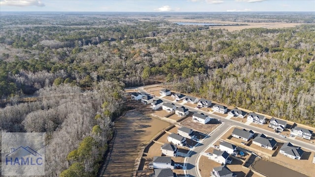 bird's eye view with a forest view and a residential view