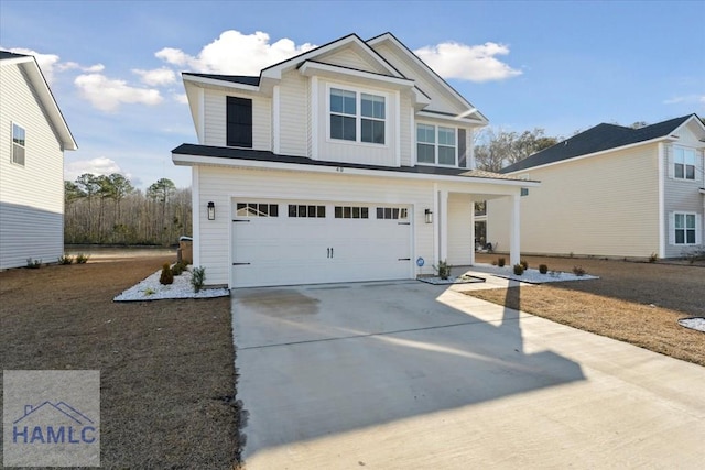 view of front of home with driveway and an attached garage