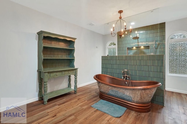 interior space featuring hardwood / wood-style floors, plenty of natural light, and a chandelier