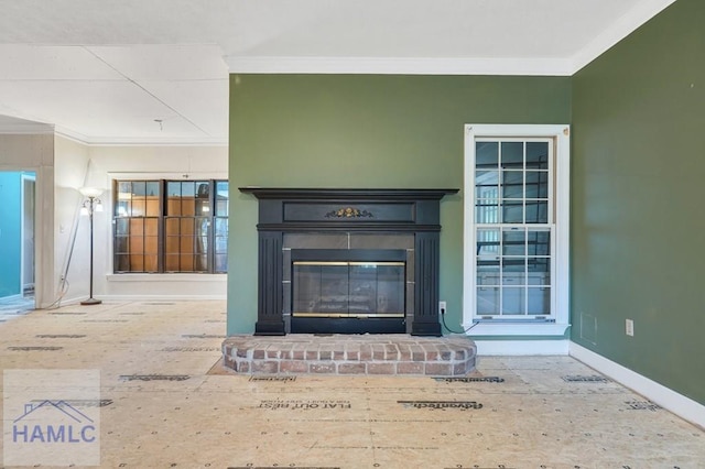 interior details with crown molding and a fireplace