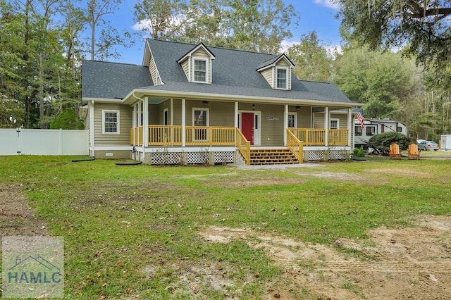 view of front of home with covered porch and a front lawn