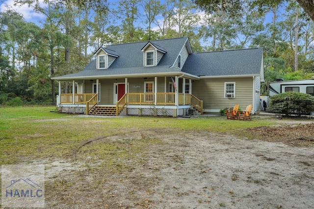 view of front of house with covered porch and a front yard