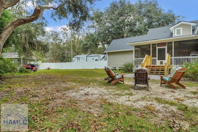 view of yard featuring a sunroom