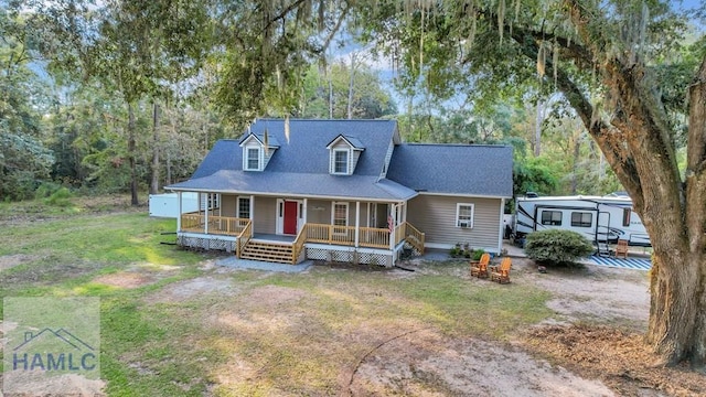 view of front of property featuring covered porch and a front lawn