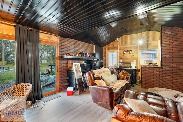 living room with wooden ceiling, brick wall, lofted ceiling, wooden walls, and light wood-type flooring