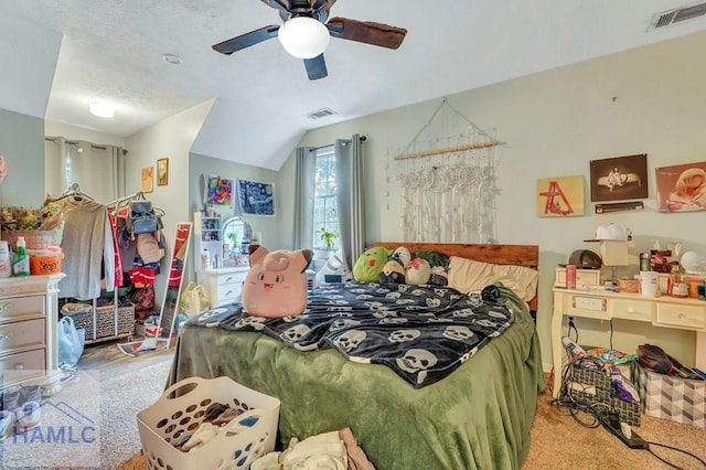 carpeted bedroom featuring vaulted ceiling and ceiling fan