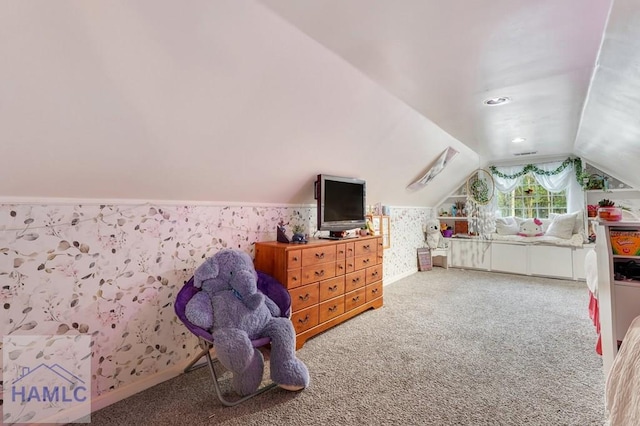 bedroom with carpet and vaulted ceiling