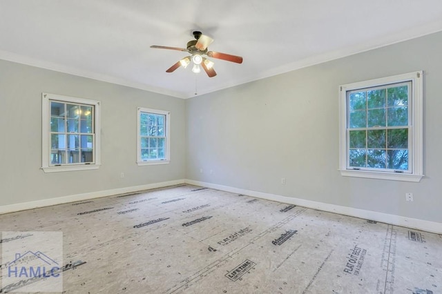 spare room with ornamental molding, ceiling fan, and a healthy amount of sunlight