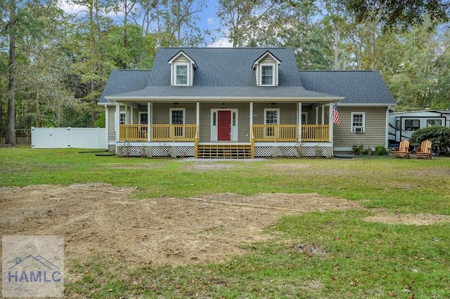 view of front facade with a front yard and a porch