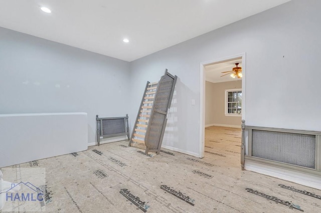 spare room featuring ceiling fan and wood-type flooring