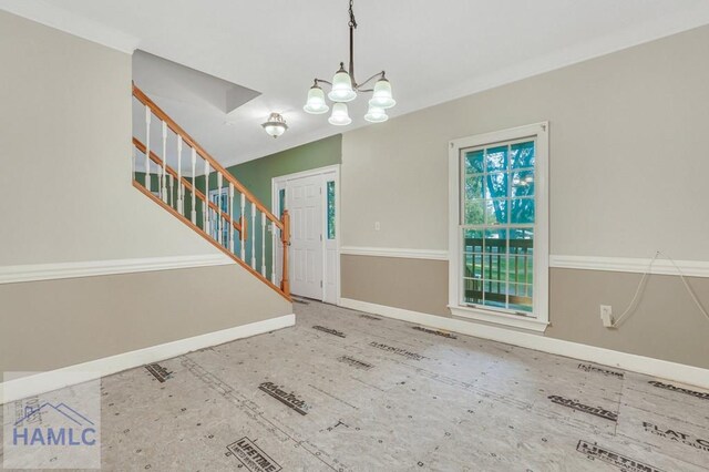 entryway featuring a chandelier