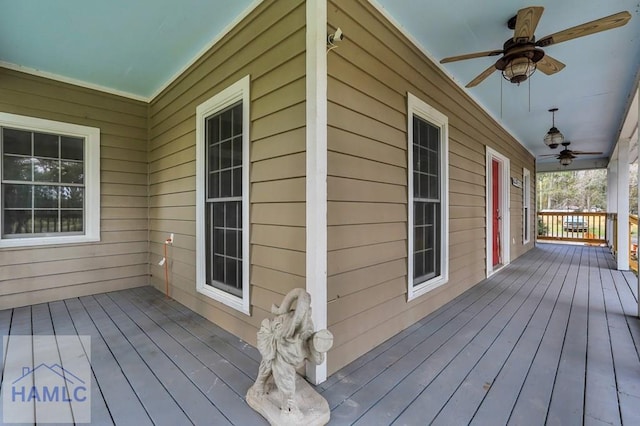 deck with covered porch and ceiling fan