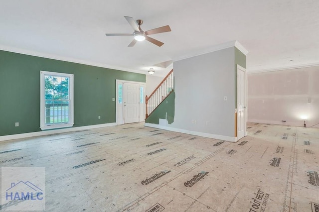 unfurnished living room with ceiling fan and crown molding